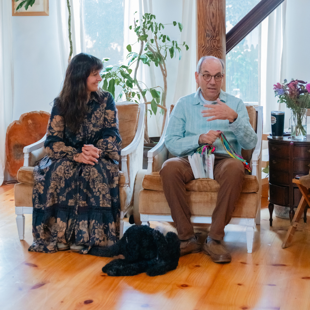A facilitator and participant seated in a gathering