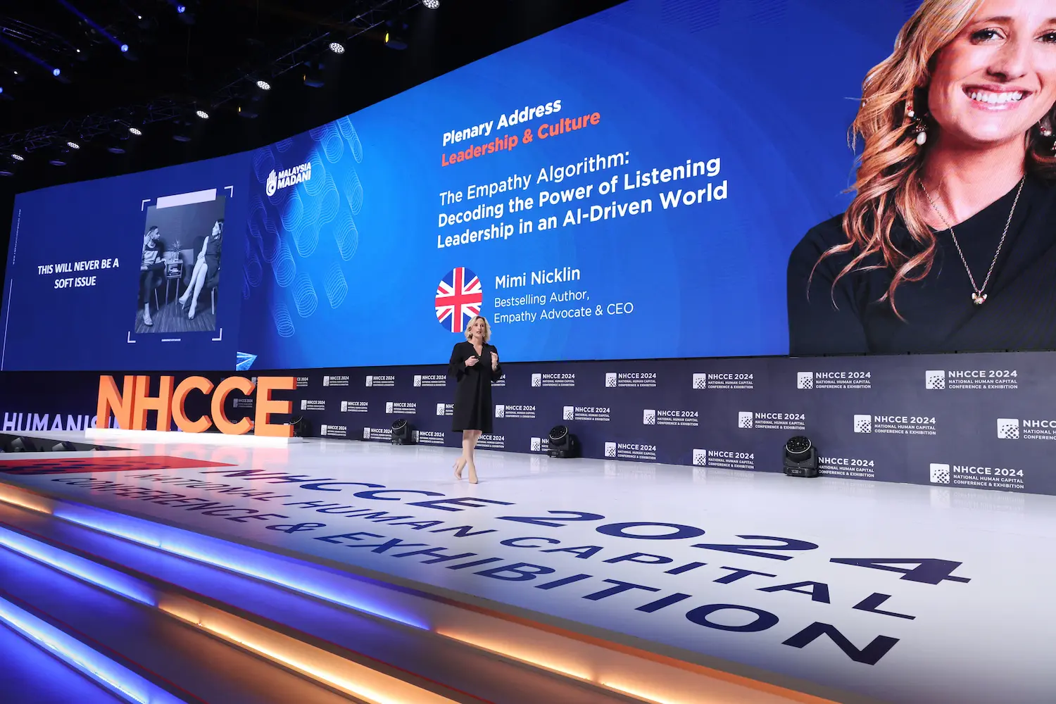 Mimi speaking at conference