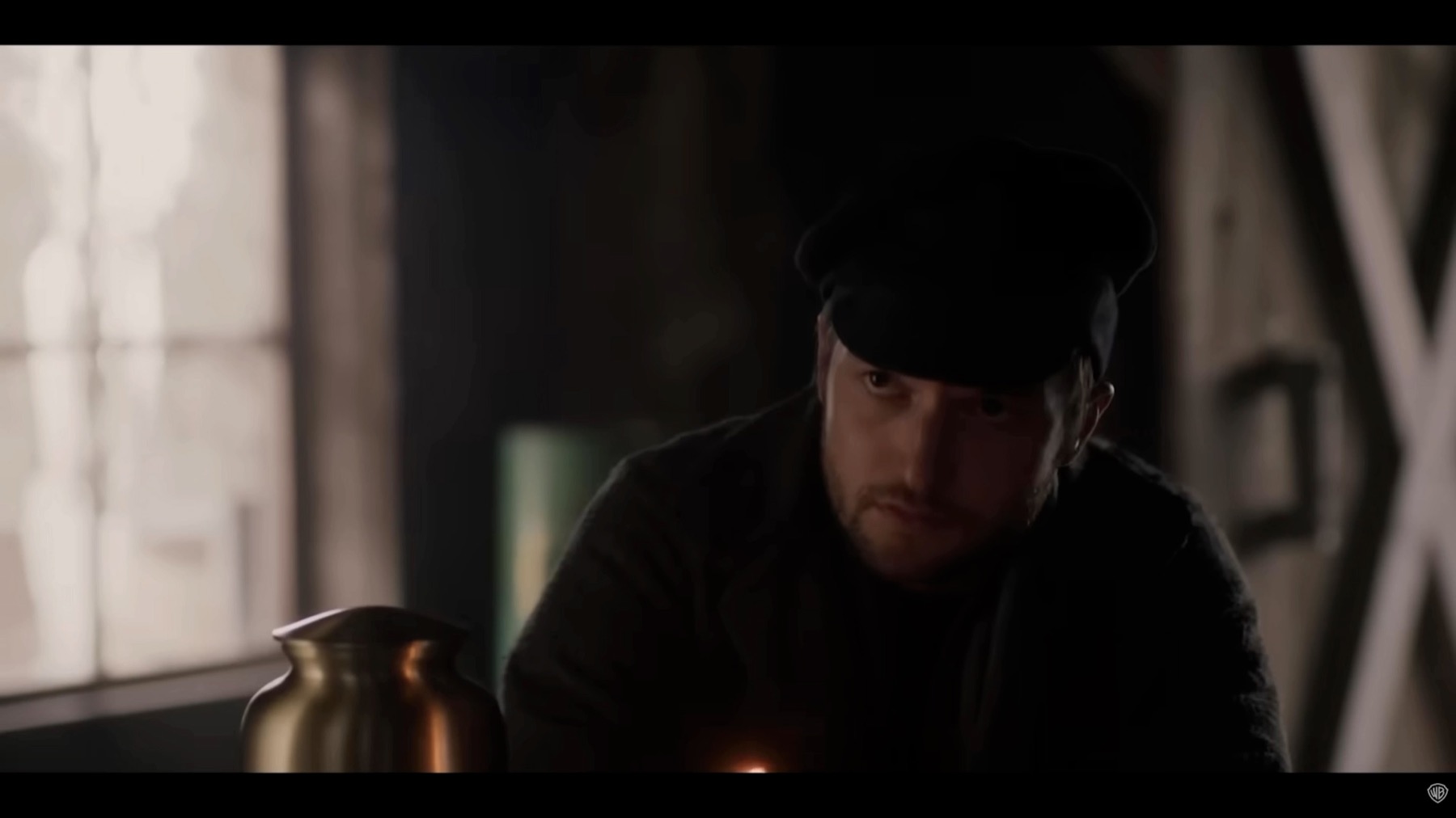 Close outpost composition from The Unholy Trinity with a character placed beside a bright window and foreground urn