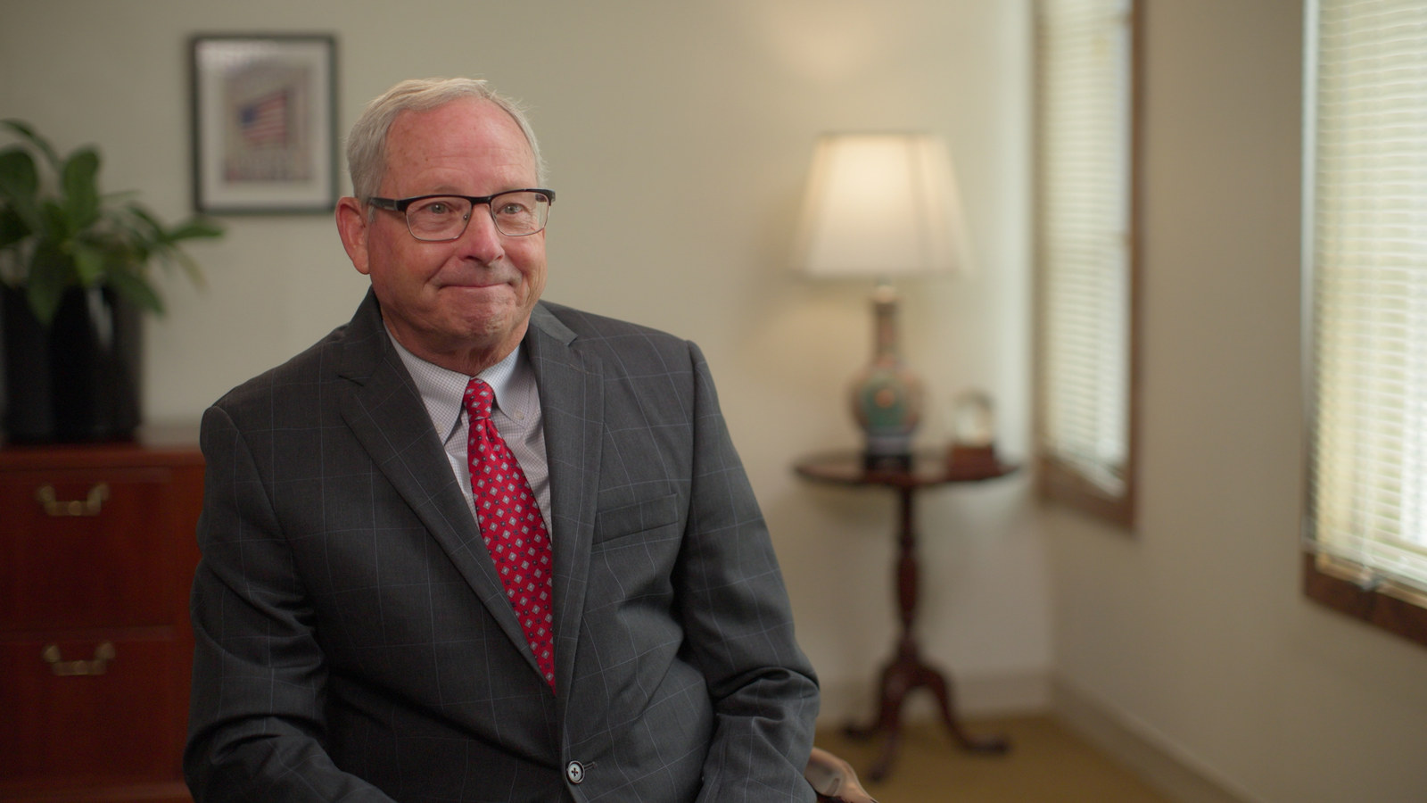 Finished graded corporate interview filmed inside a plain office