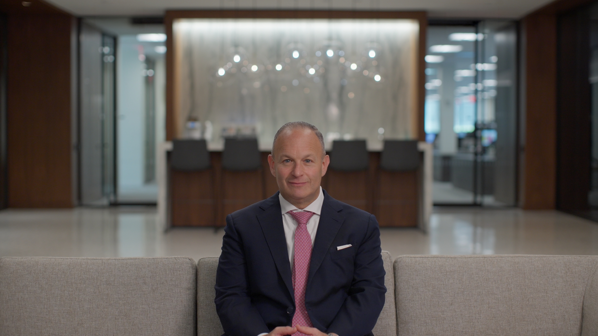 Finished Rec.709 interview frame in the bright corporate lobby