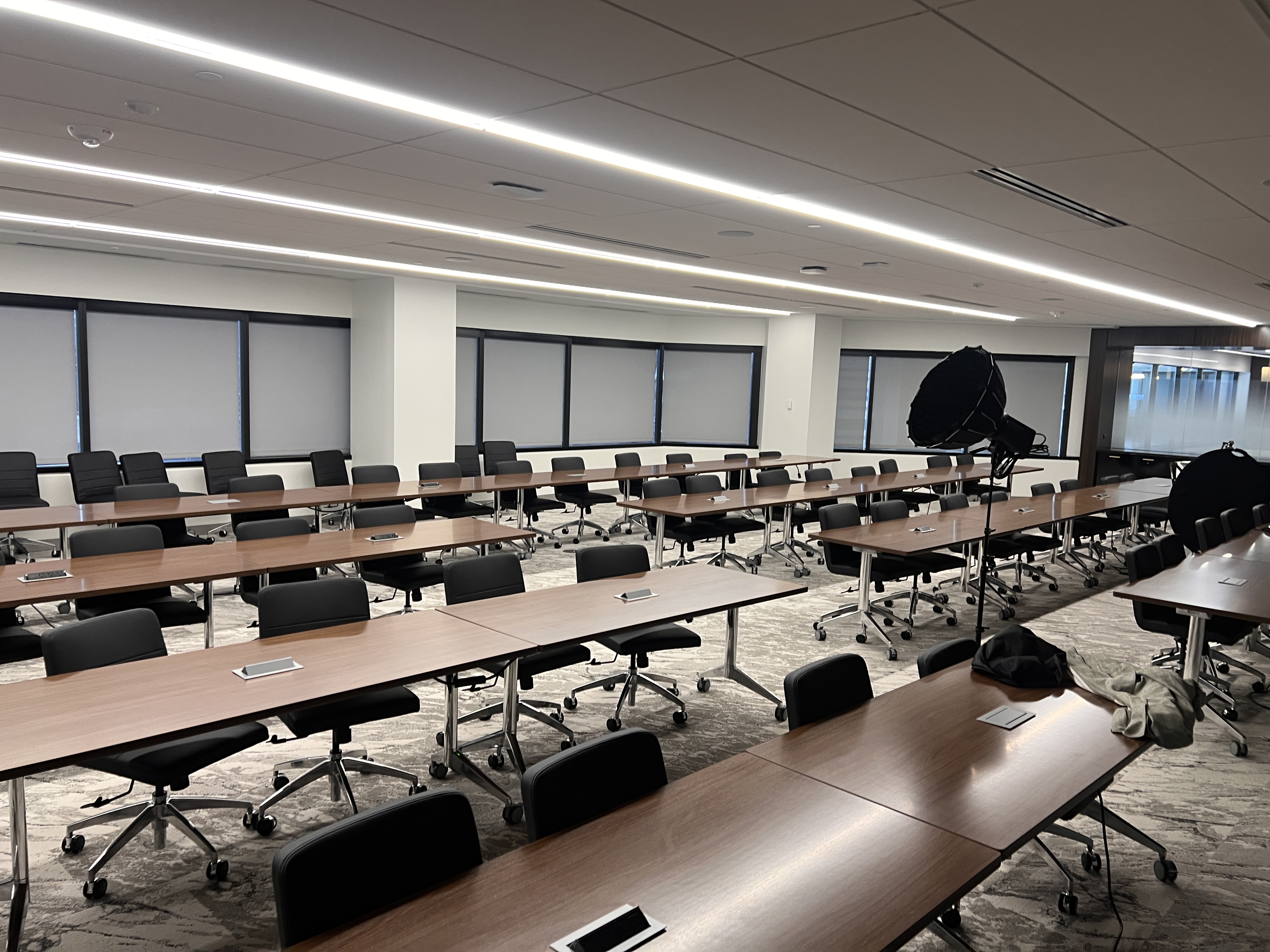 Wide view of the large conference room before the interview lighting was shaped