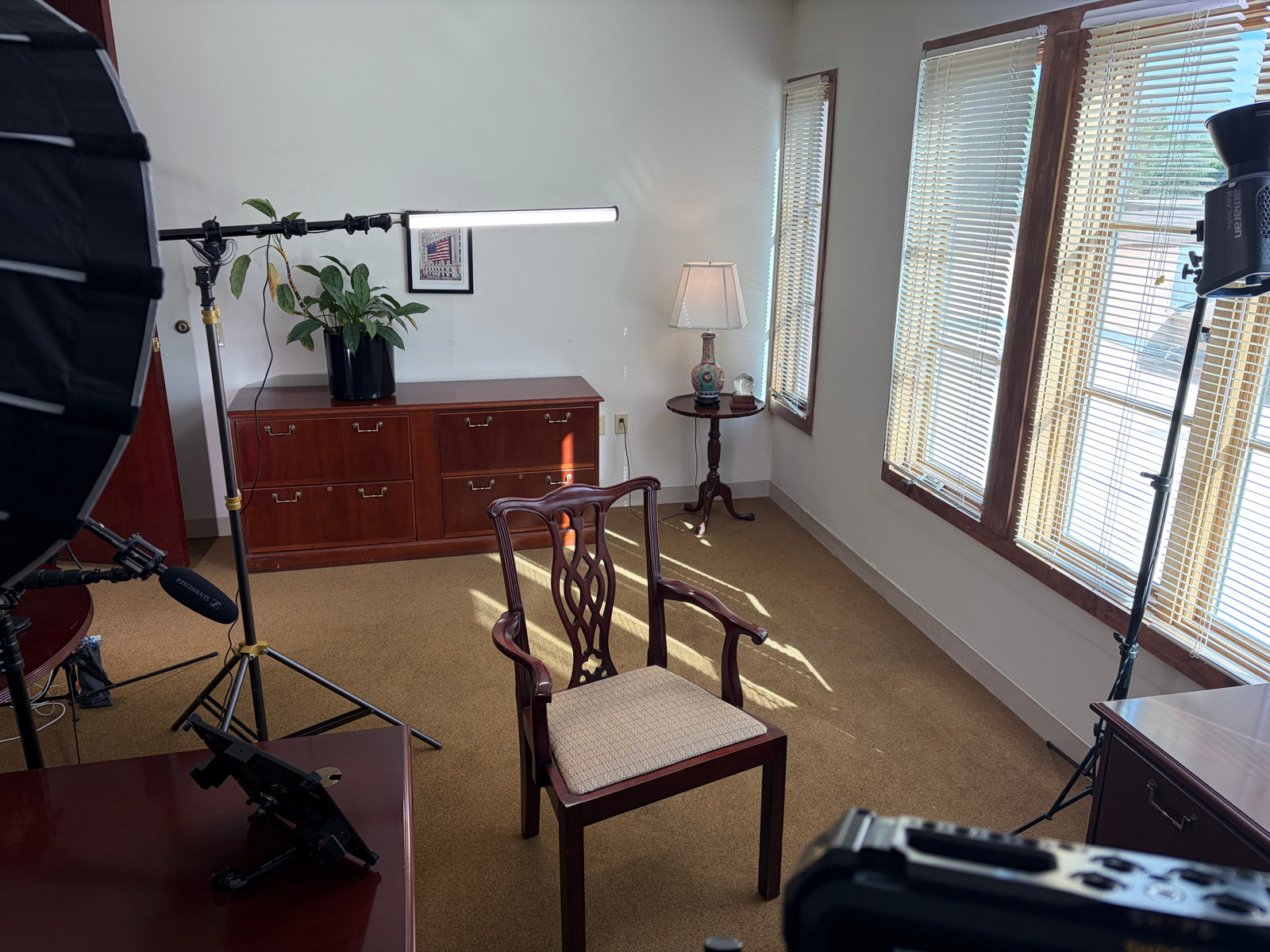 Complete behind-the-scenes lighting arrangement for an interview in a plain office