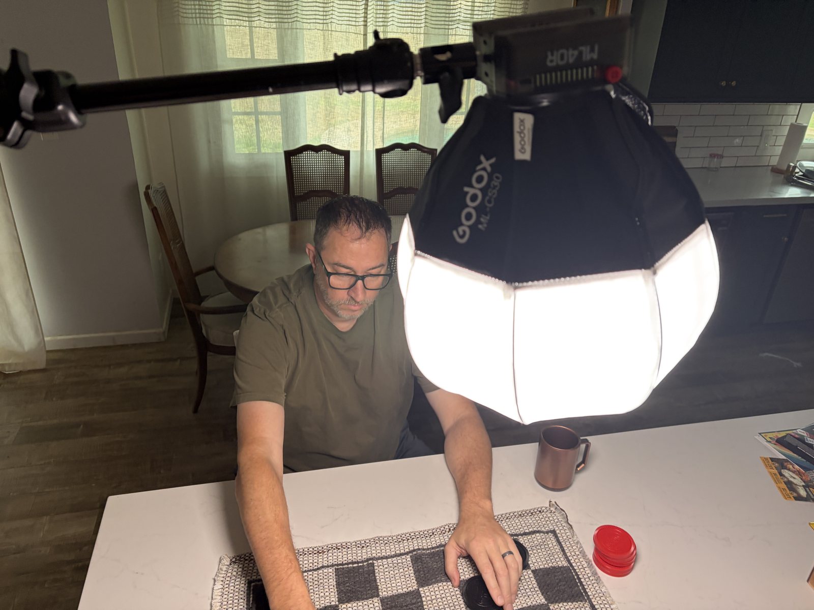 Godox ML40R and compact lantern suspended over a tabletop filming setup