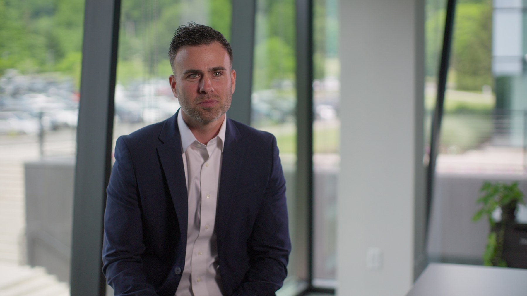 Finished Rec.709 interview frame using the glass conference room window as the key light