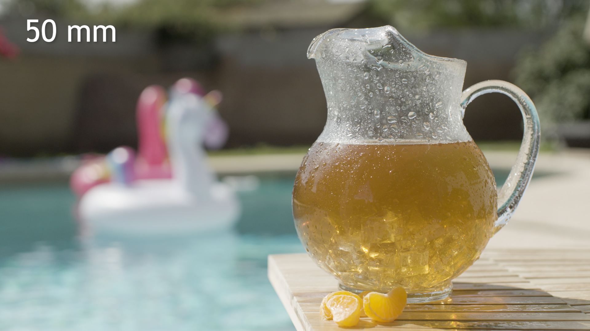 Pitcher photographed at 50mm with a more balanced relationship to the pool background