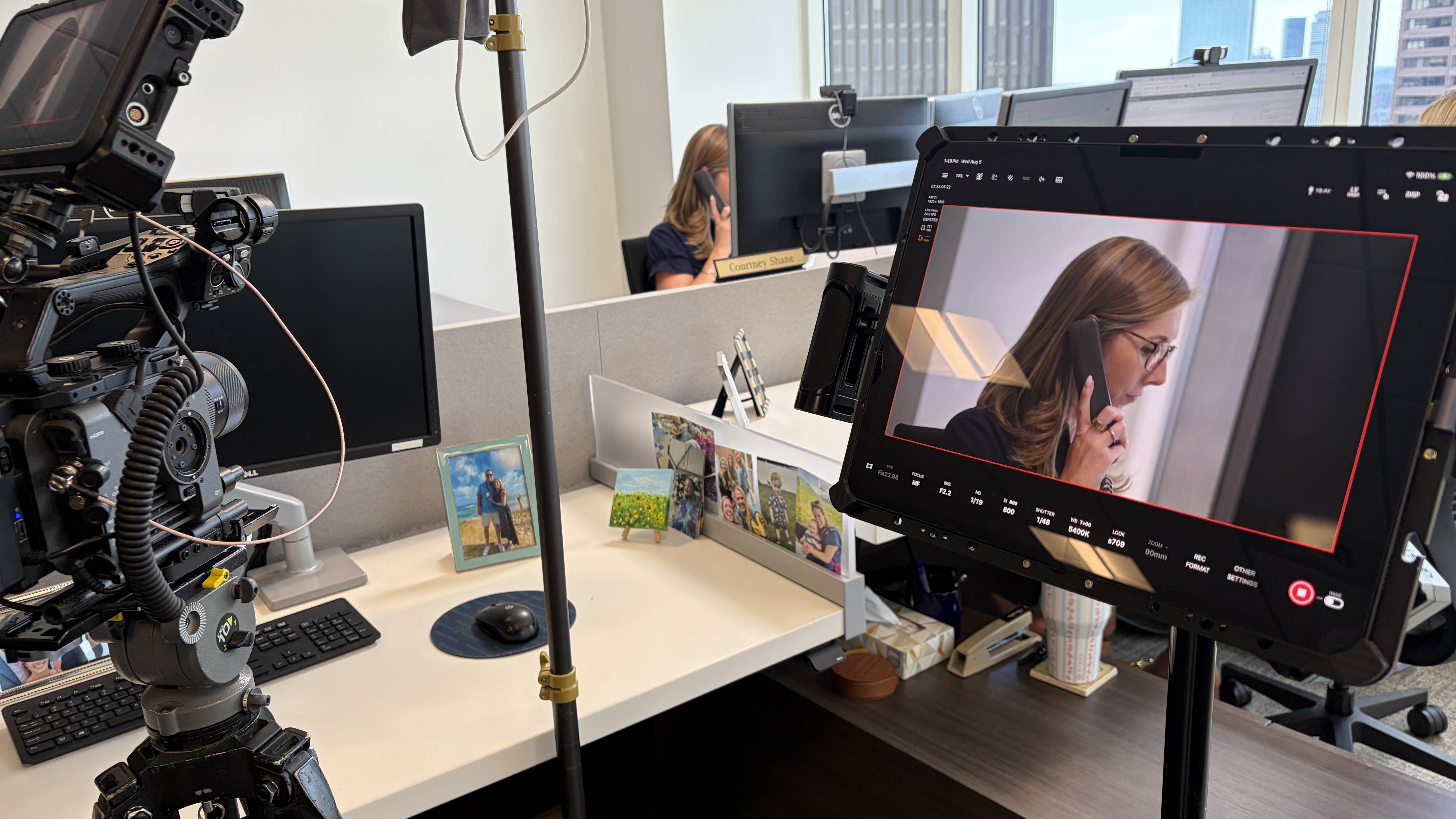 Cinema camera and monitor capturing a tight office workstation shot with the 90mm lens