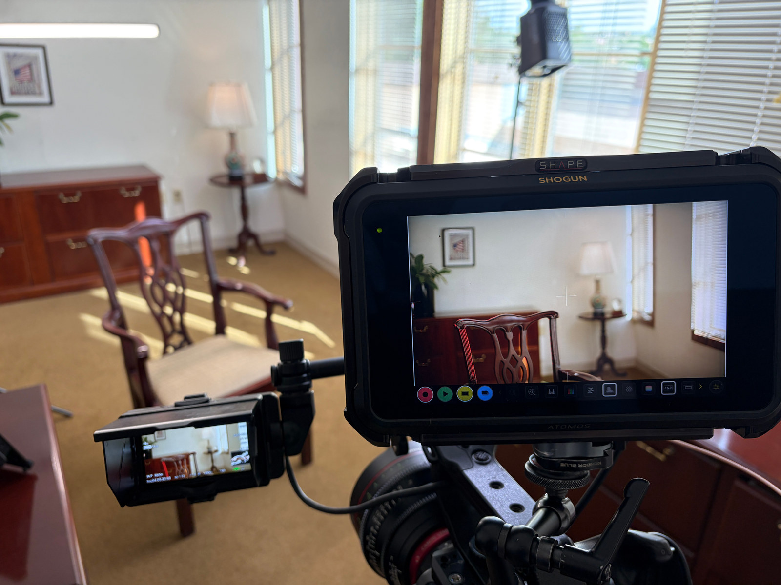 Camera and production monitor showing the finished interview composition