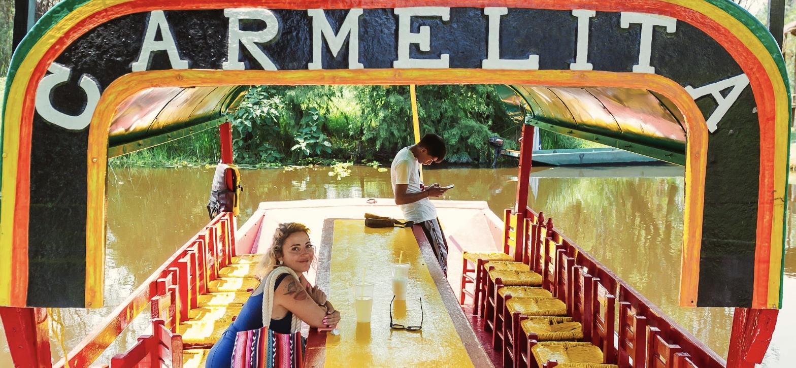 Daniele seated on the Carmelita trajinera in Xochimilco