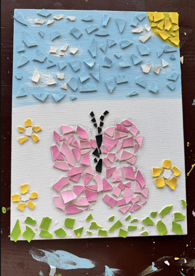 Paper mosaic butterfly artwork made during the fellowship