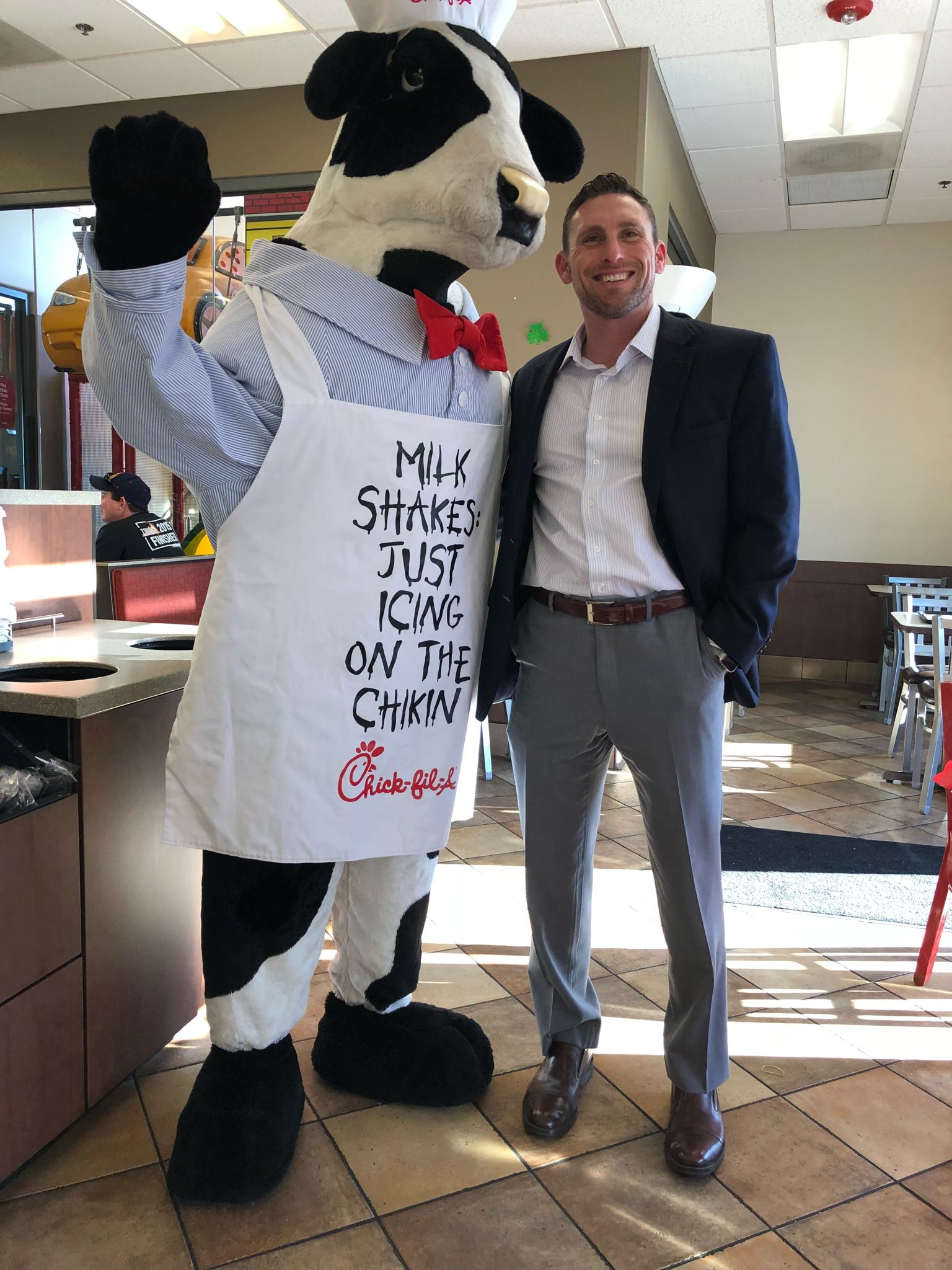 Jason next to the Chick-fil-A cow