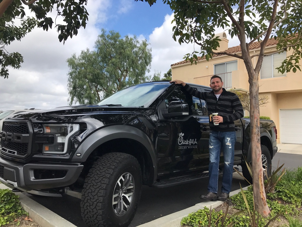 Jason next to the Chick-fil-A Symbol of Success Raptor