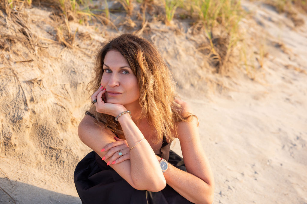 Kasia Jamroz seated on the beach