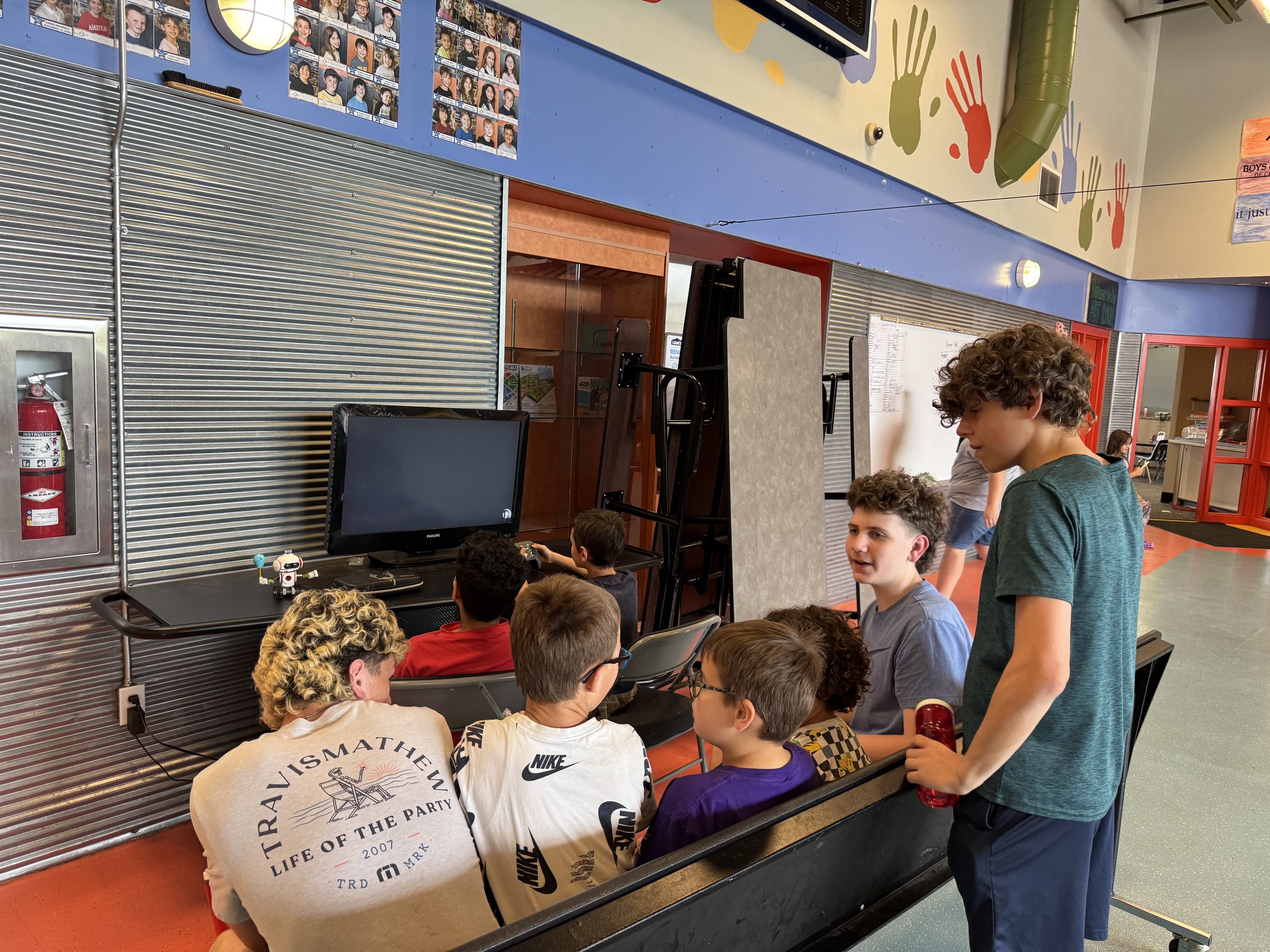 PROSPER interns connecting with young people during an indoor community event