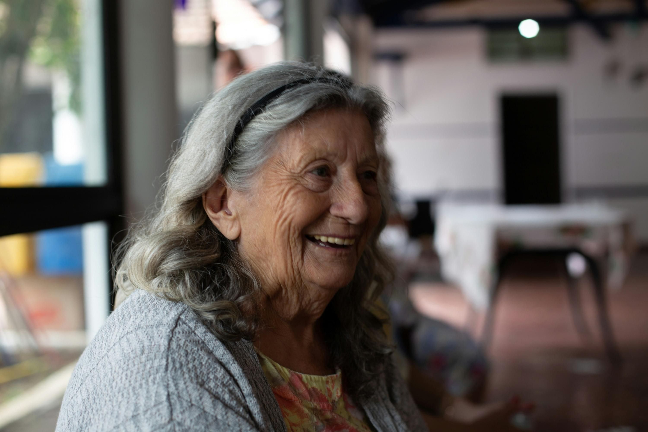 Older woman smiling indoors