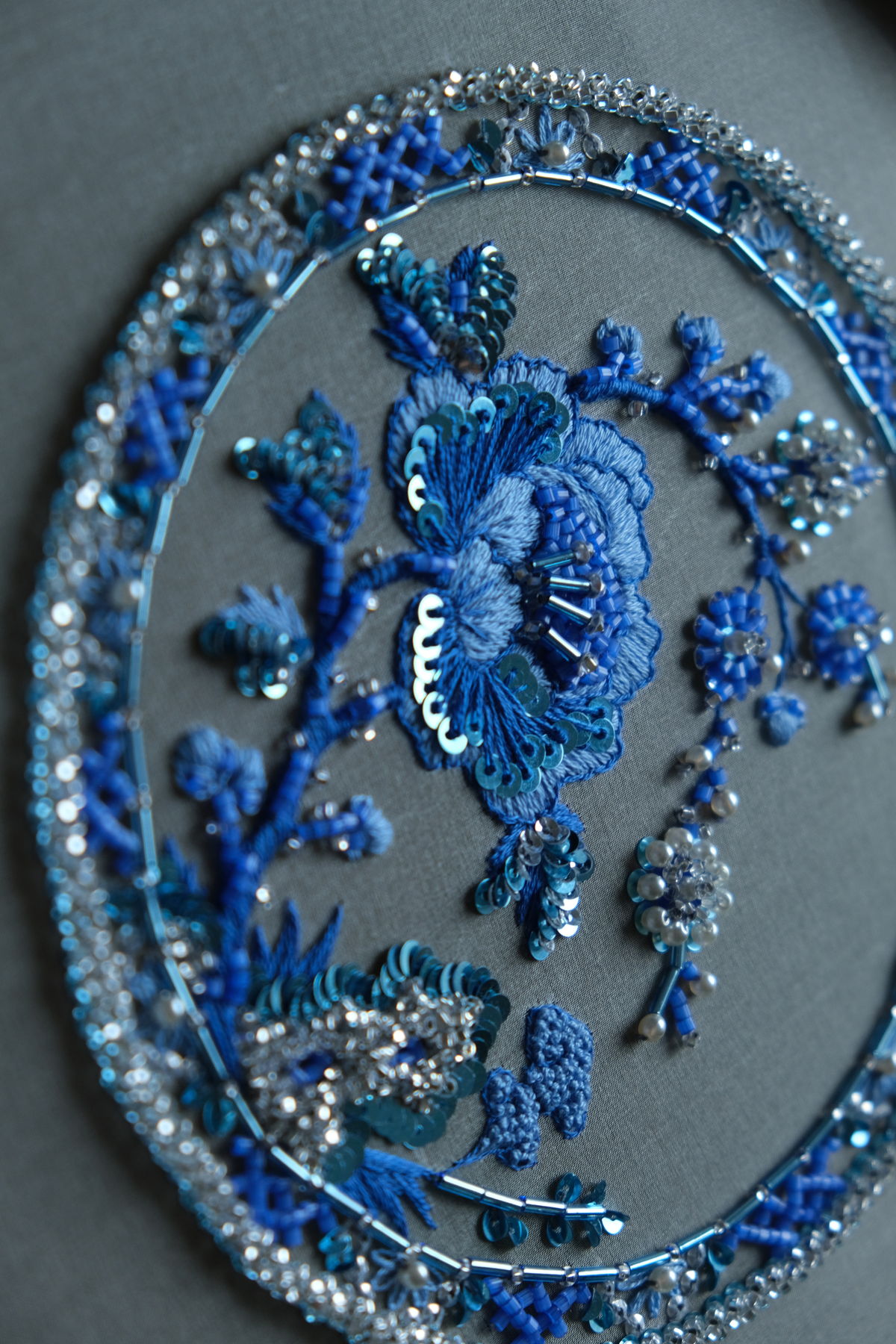 Blue flower embroidered with sequins, beads and thread
