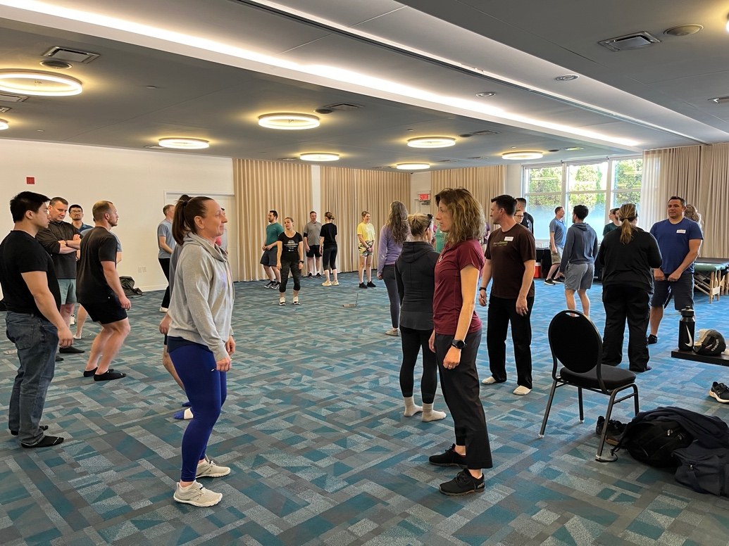 Practitioners working together during a live Reconditioning session