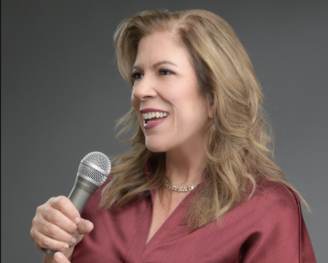 Jocelyn King speaking with a microphone