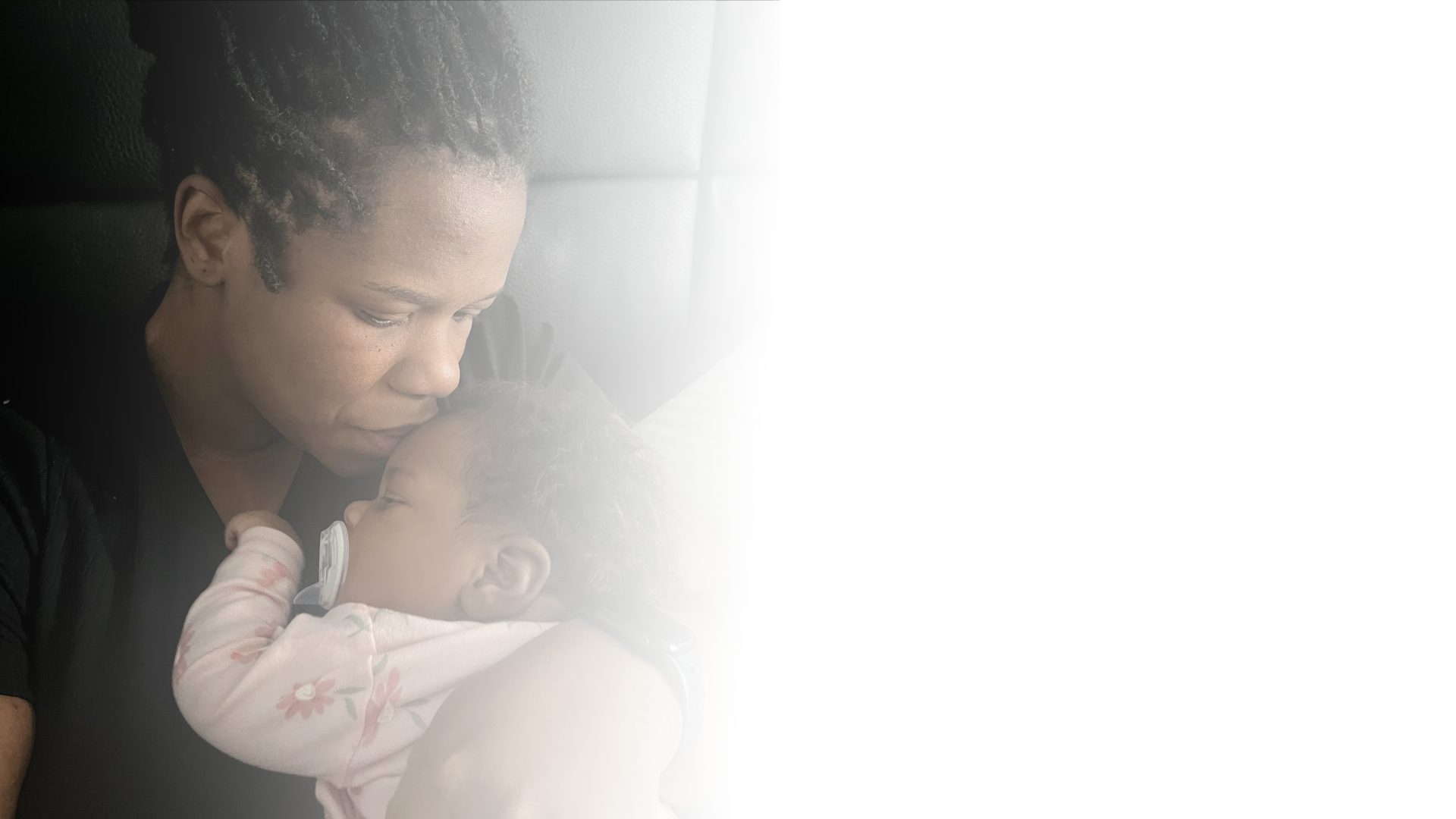 A mother holding her newborn