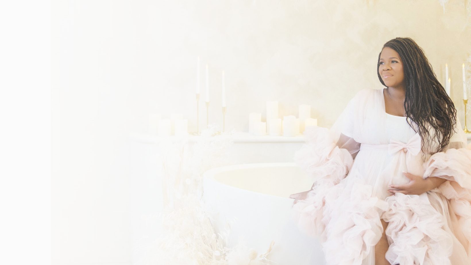 Sophie, pregnant, in a pink tulle gown