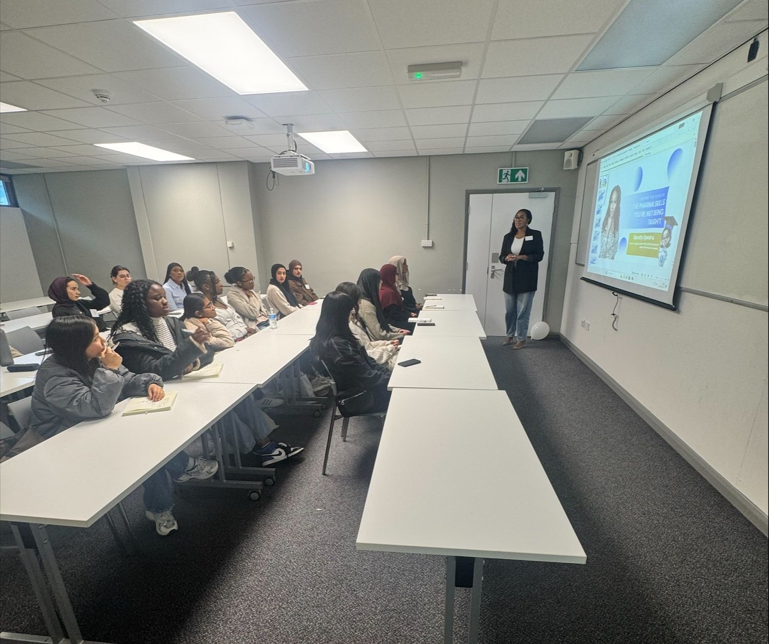 Dorothy Ogwuru delivering a guest lecture to university pharmacy students
