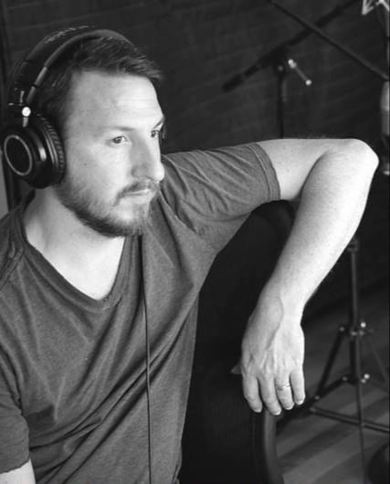 Todd Boston listening in the studio