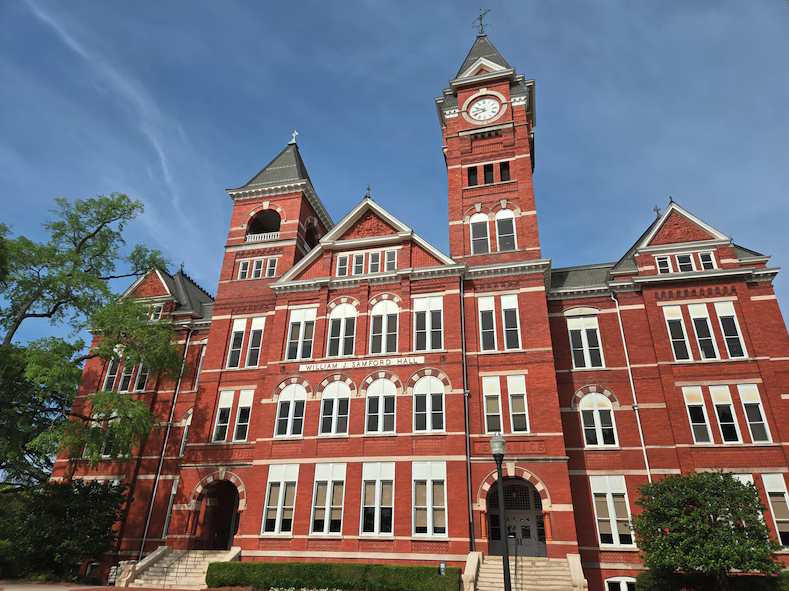 Auburn University entrance sign with Samford Hall in the background