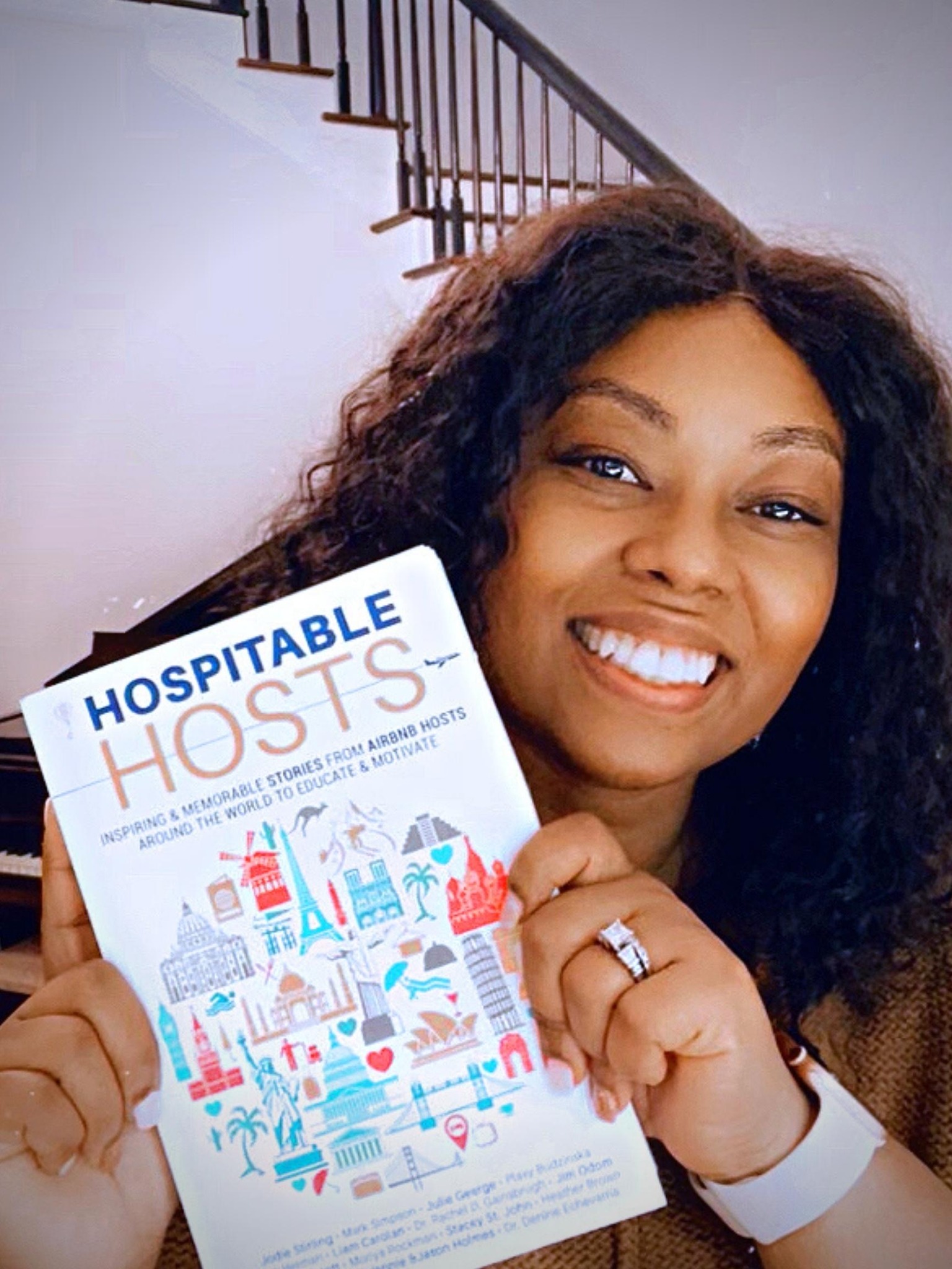 Rachel Gainsbrugh holding Hospitable Hosts
