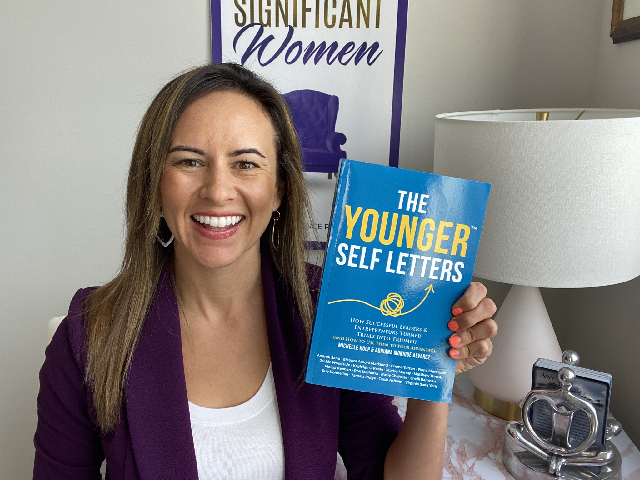 Kayleigh O'Keefe holding The Younger Self Letters