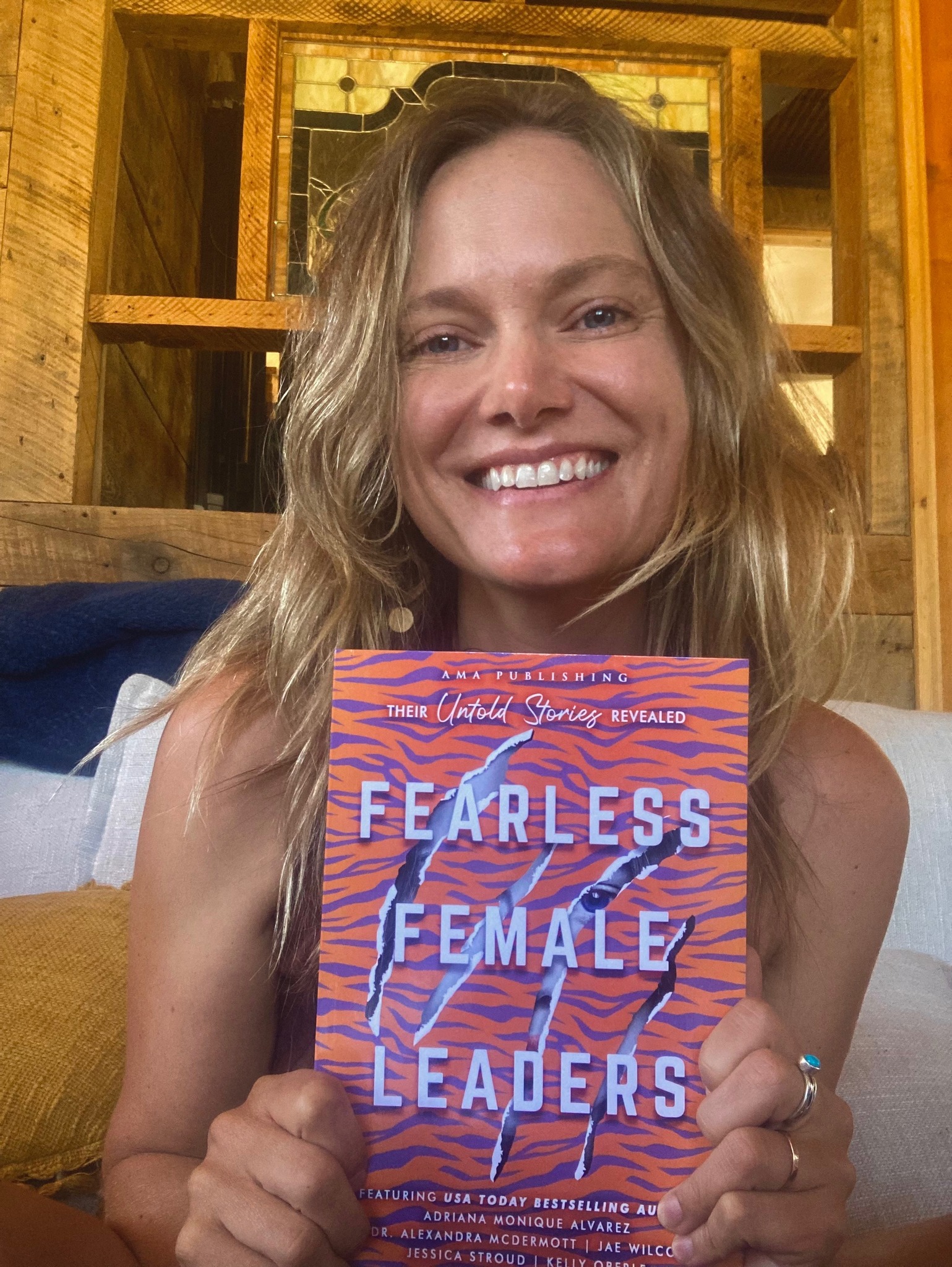 Caroline Lewis holding Fearless Female Leaders