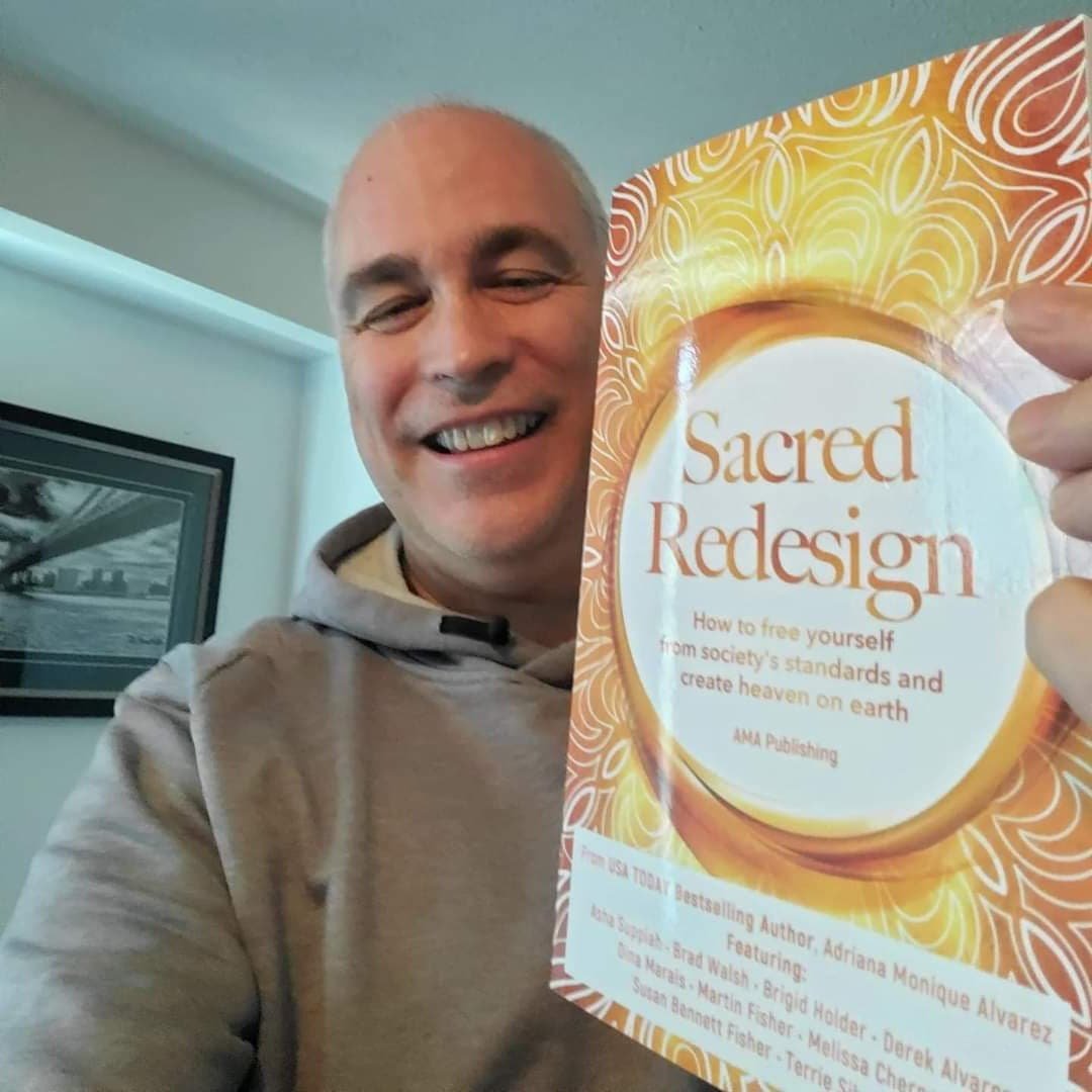 Brad Walsh holding Sacred Redesign