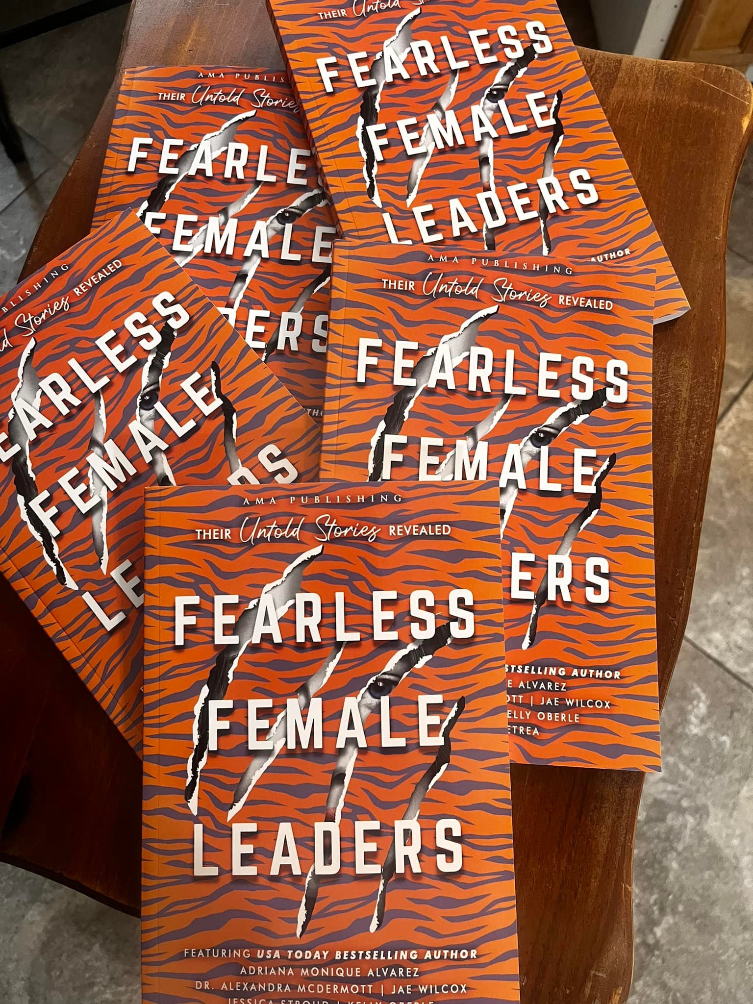 Stack of printed Fearless Female Leaders books