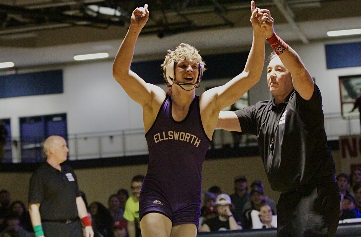 Anthony wrestling, arms raised in victory, Ellsworth