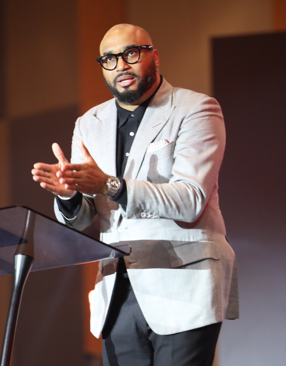 Mark Moore Jr. speaking on stage