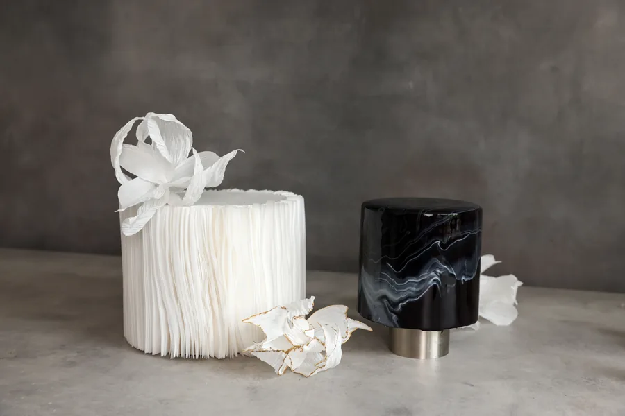 Wafer paper cake beside a black mirror gloss cake