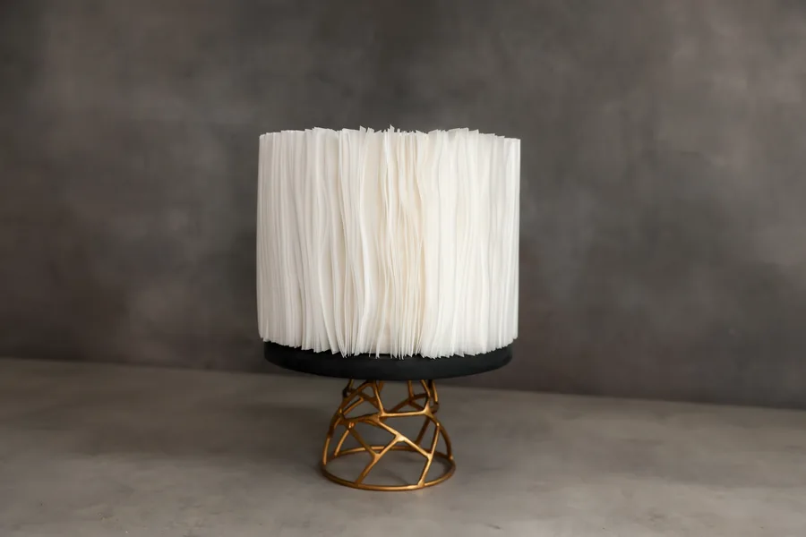 Wafer paper cake alone on a gold stand