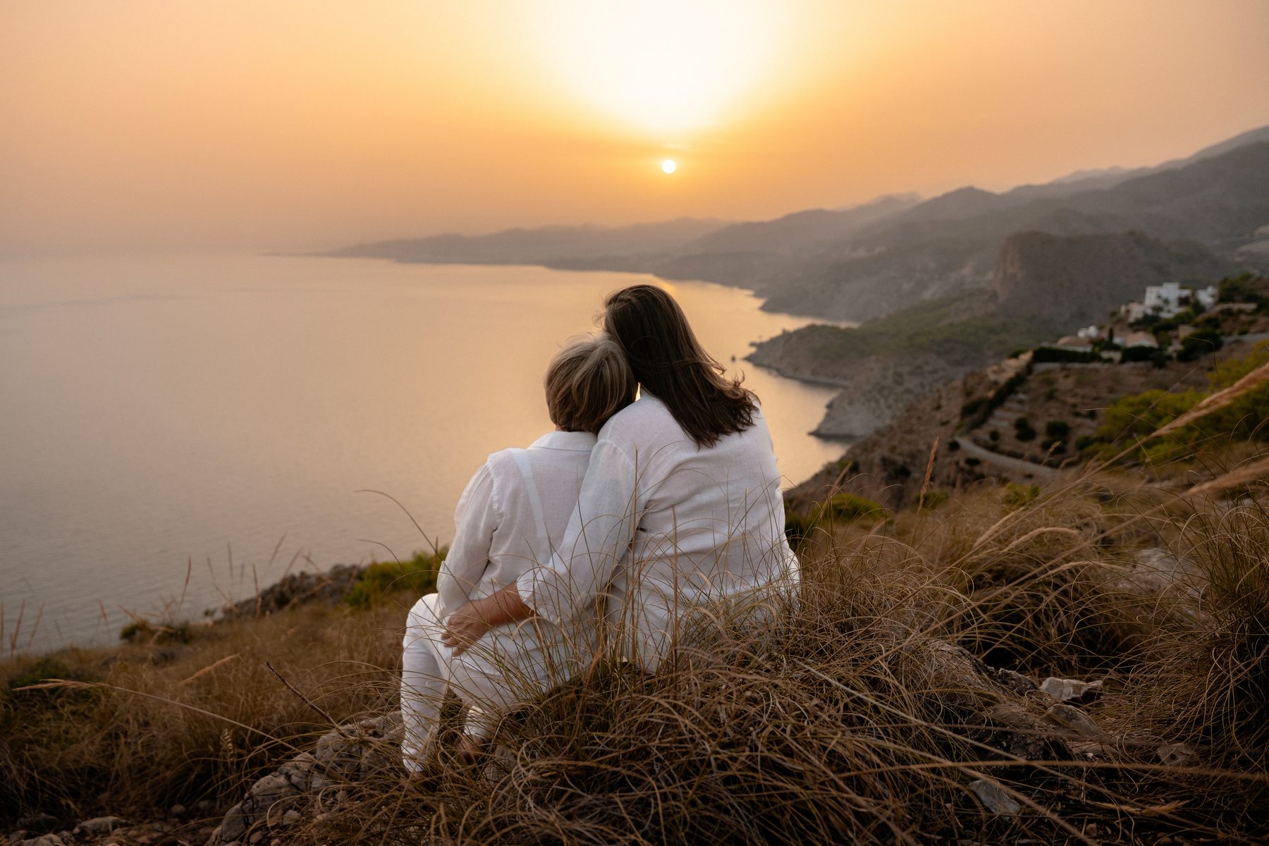 Tammy and her partner watching the sun set over the Mediterranean