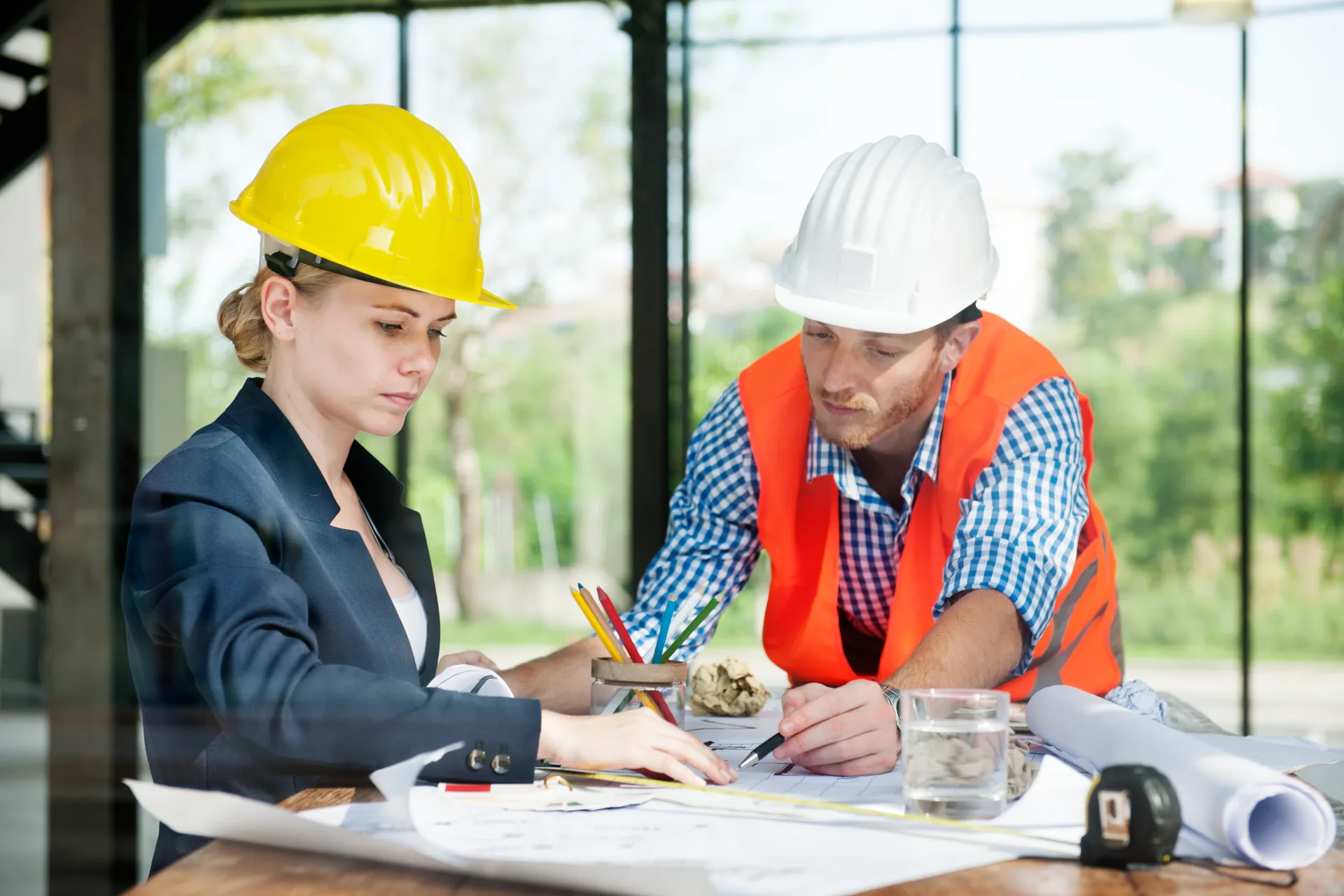Construction site supervisors reviewing plans