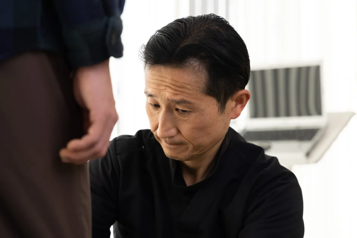 Sonobe examining movement findings during a clinical assessment