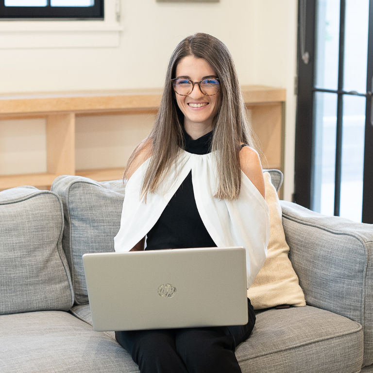 Photograph of Alejandra Marqués working on her laptop