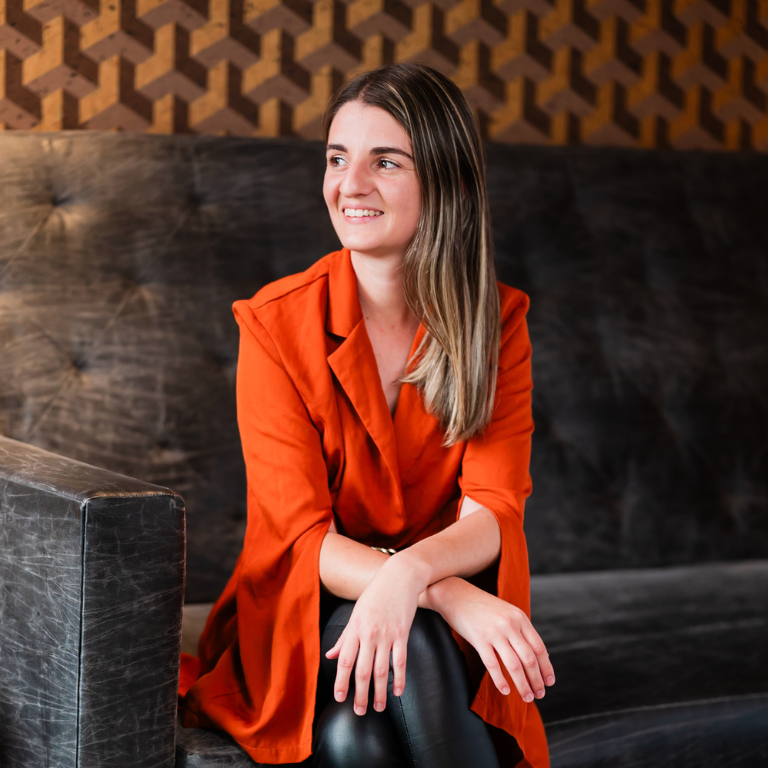 Photograph of Alejandra Marqués in an orange blazer