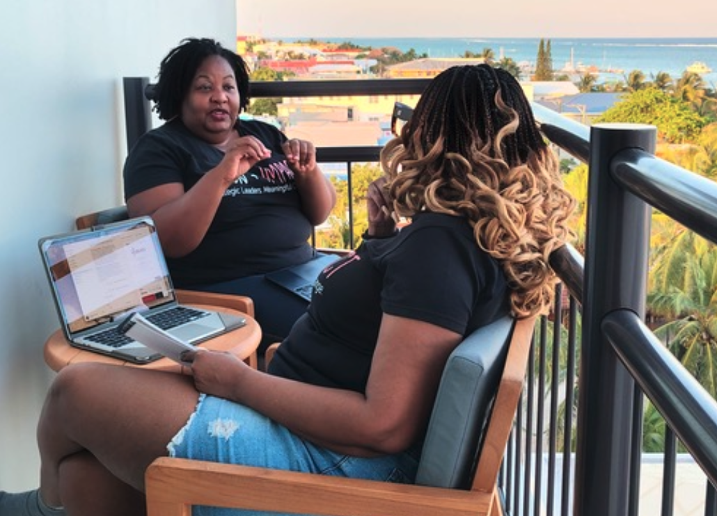 Dr. Nicole Robinson in conversation with a client in Belize