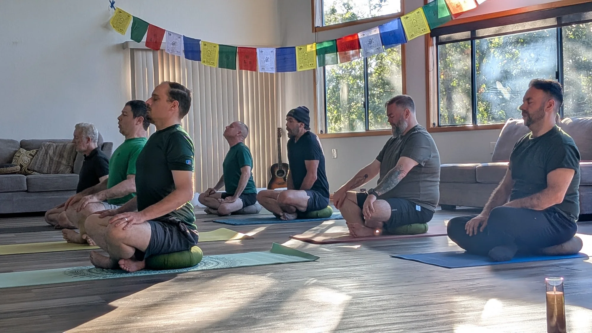 Men participating in an indoor embodiment practice