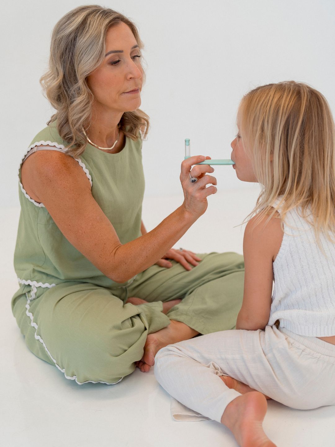 Tash doing breathwork with a child