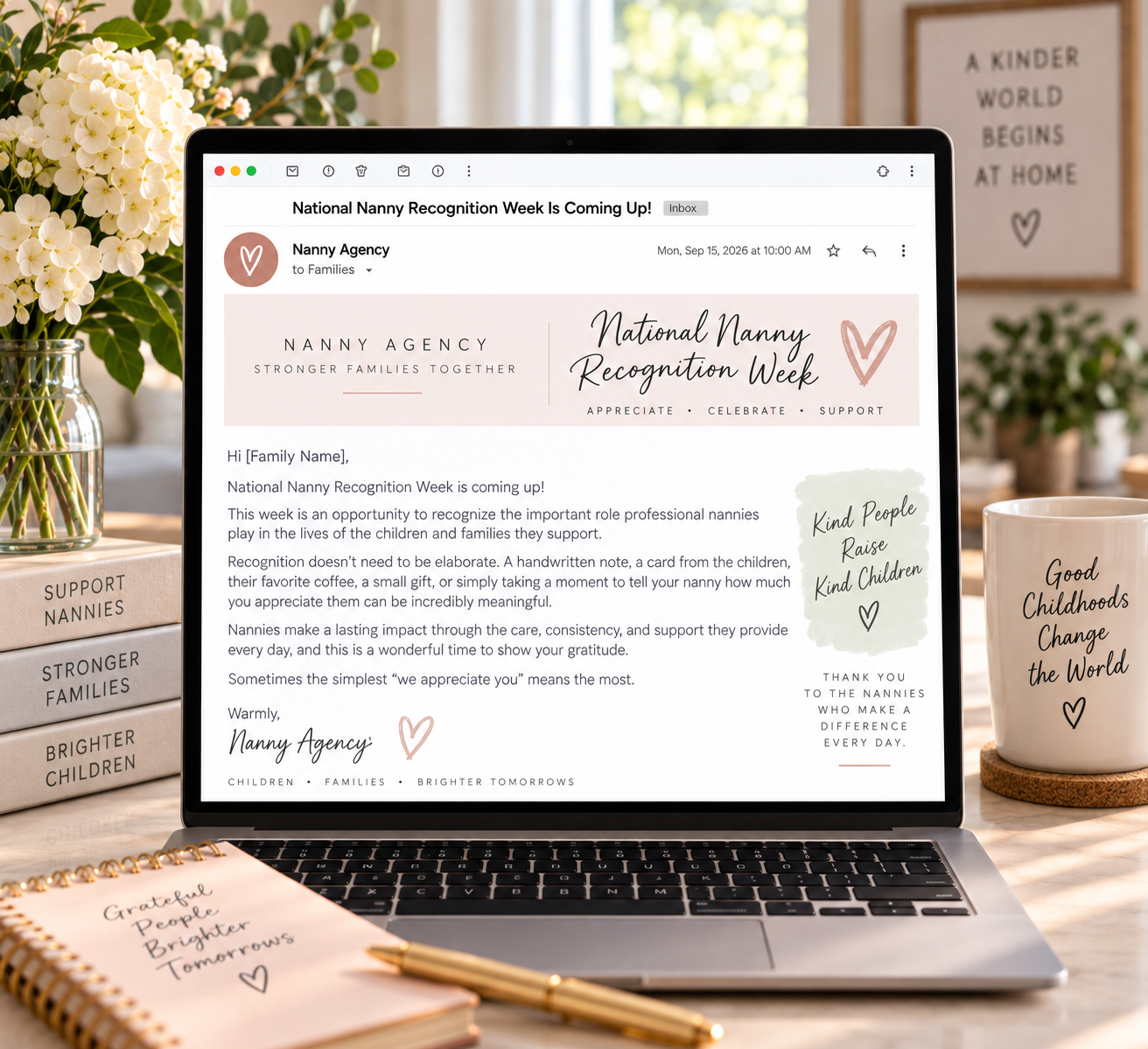 A laptop displaying a nanny agency email about National Nanny Recognition Week beside flowers, a notebook and a mug