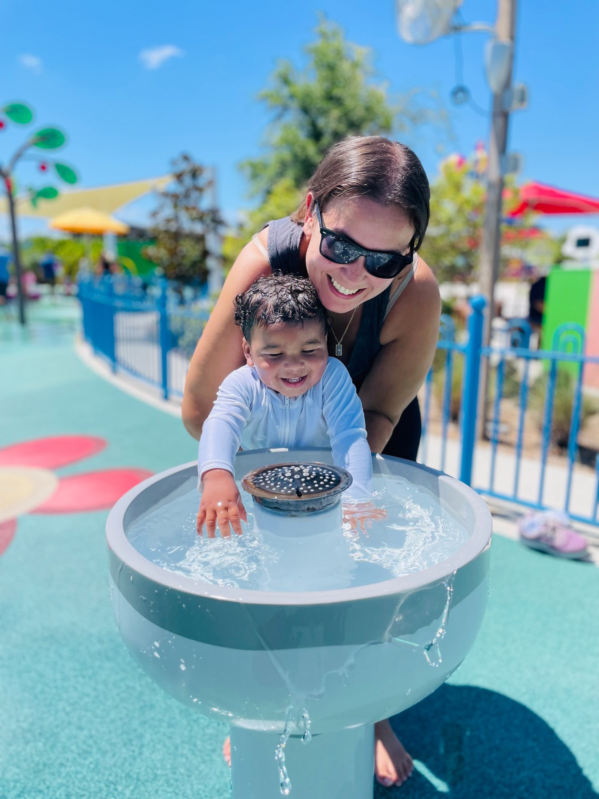 Professional caregiver sharing playful learning with a toddler