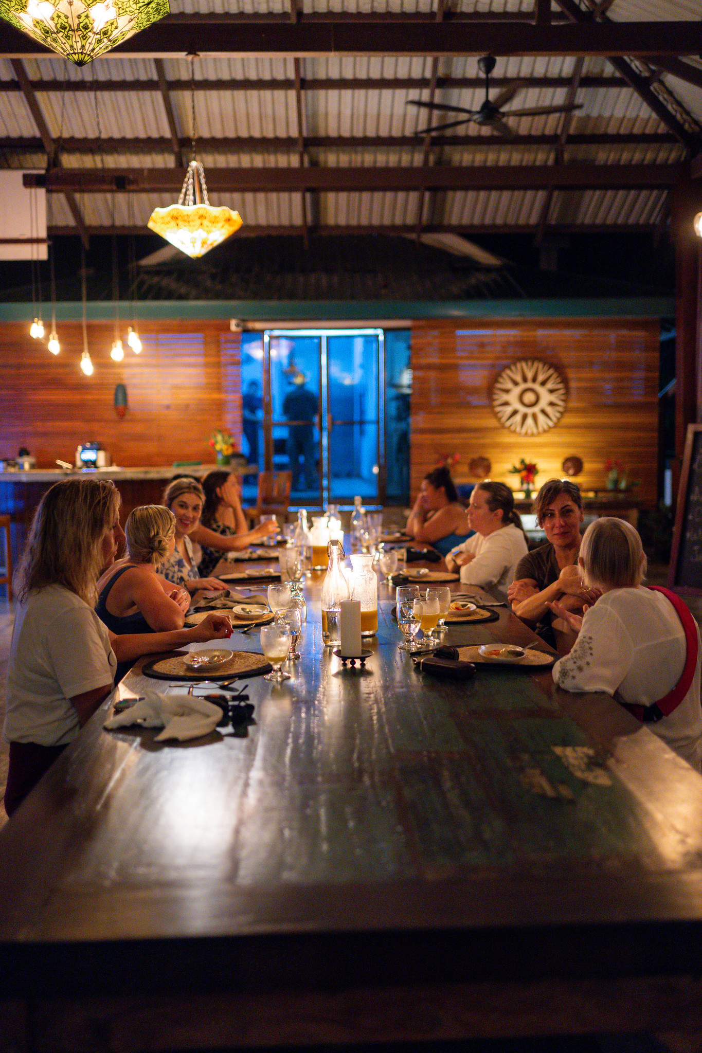 Women sharing dinner during a Rooted Reset™ retreat