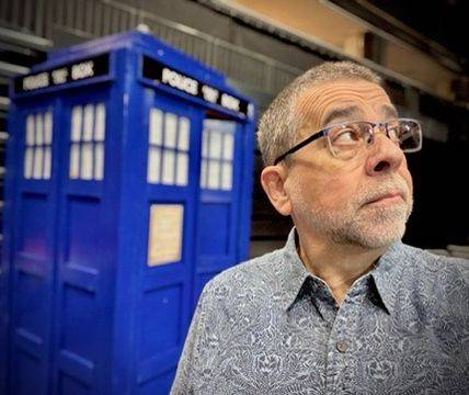Mike Quinn beside a blue police box