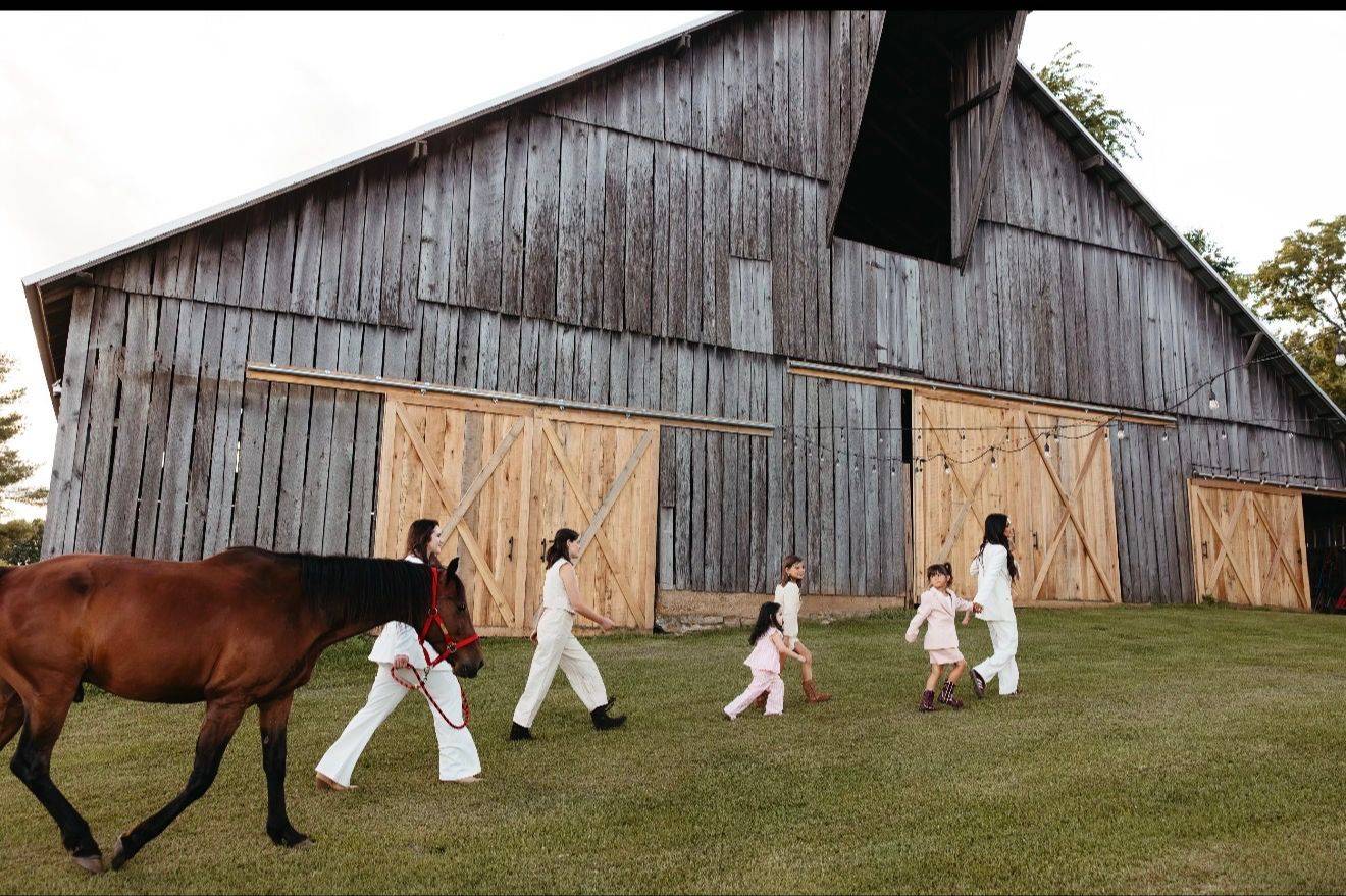 Family walking together at the barn