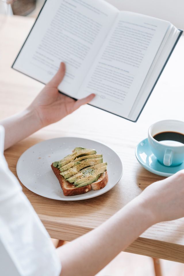 Woman with coffee reading